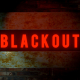 Schriftzug Blackout in Rot auf schwarzem Hintergrund